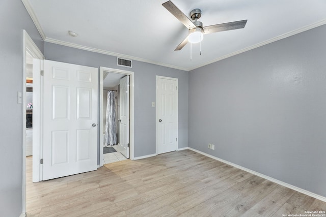 8655 Datapoint Dr Unit 212, San Antonio, TX 78229 - unfurnished bedroom featuring baseboards, wood finished floors, visible vents, and ornamental molding