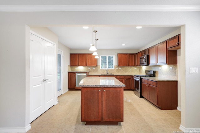 kitchen featuring light stone countertops, stainless steel appliances, sink, pendant lighting, and a center island