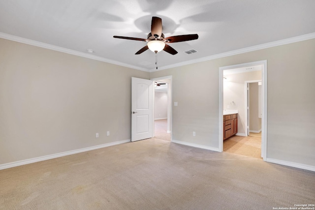 unfurnished bedroom featuring connected bathroom, ceiling fan, and crown molding