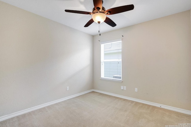 unfurnished room with ceiling fan and light colored carpet