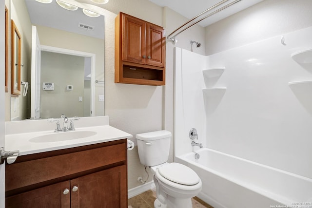 full bathroom with tile patterned floors, shower / washtub combination, vanity, and toilet