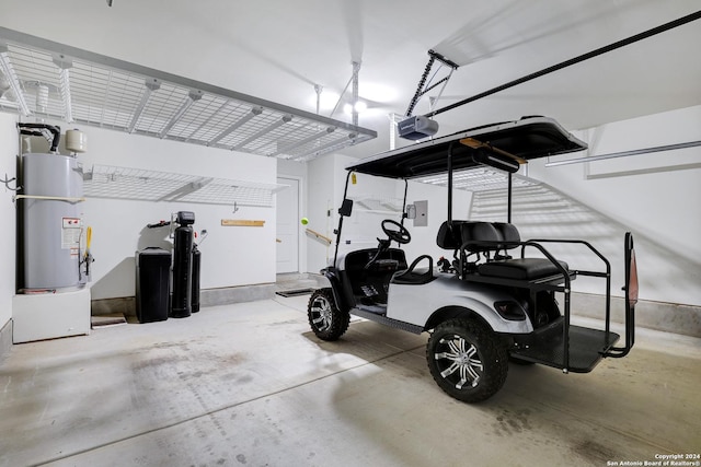 garage with secured water heater and a garage door opener