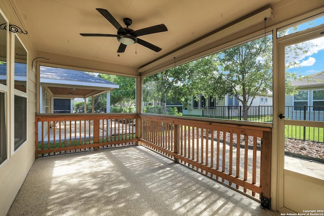 wooden terrace featuring ceiling fan and a porch