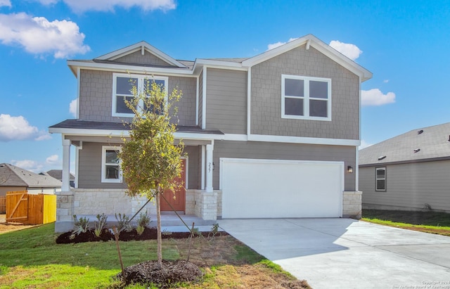 view of front of house featuring a front yard and a garage