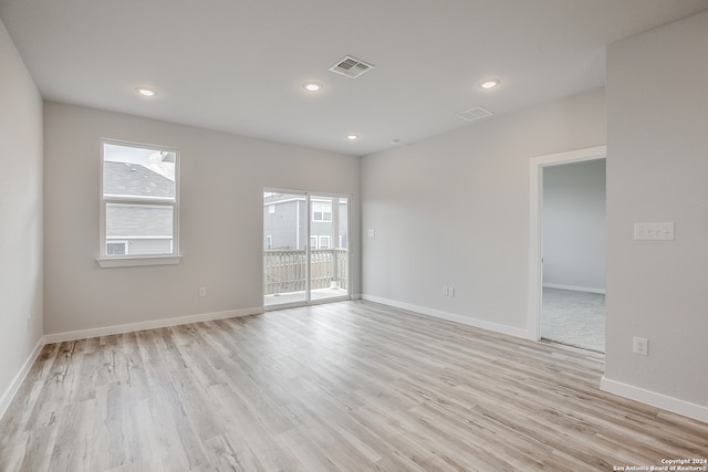 spare room with light wood-type flooring