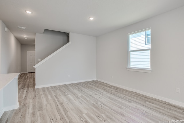 spare room with light wood-type flooring