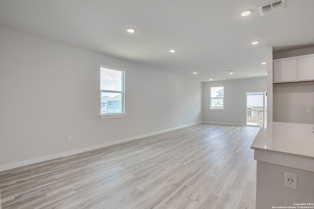 unfurnished living room with light wood-type flooring