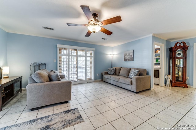 tiled living room featuring ceiling fan and ornamental molding