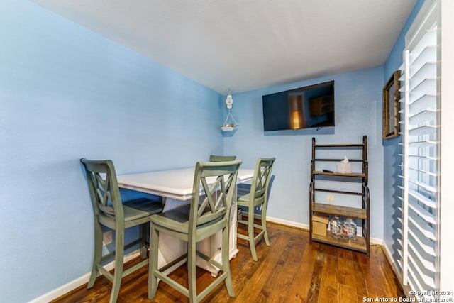 dining room with dark hardwood / wood-style floors