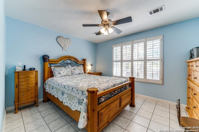 bedroom featuring ceiling fan and light tile patterned flooring