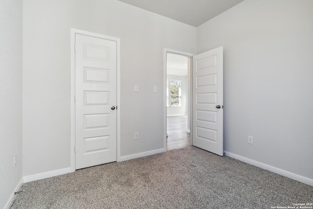 unfurnished bedroom featuring light colored carpet