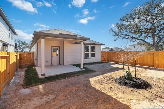 rear view of house with a patio