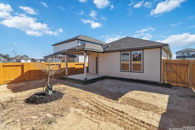 back of property with a patio area