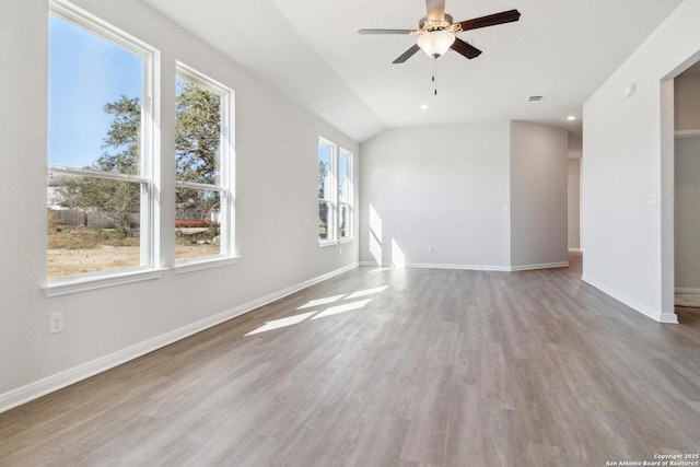 unfurnished living room featuring hardwood / wood-style floors, ceiling fan, and lofted ceiling