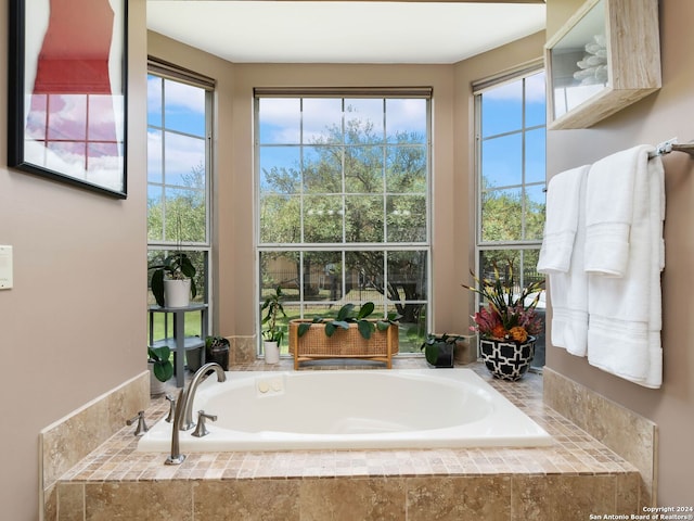 bathroom with tiled tub