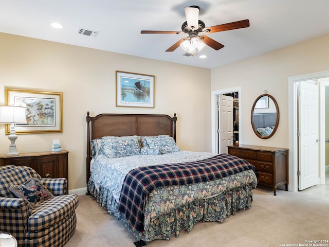 bedroom featuring ceiling fan and light carpet