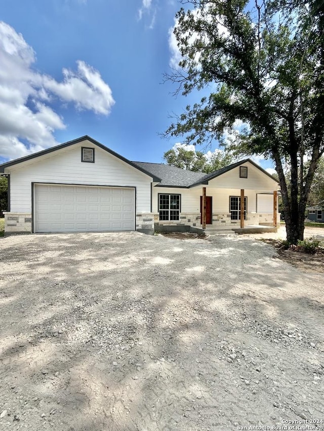 single story home with a garage