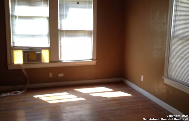 spare room featuring hardwood / wood-style flooring