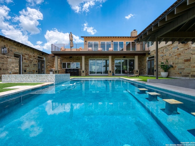 view of swimming pool with a patio area