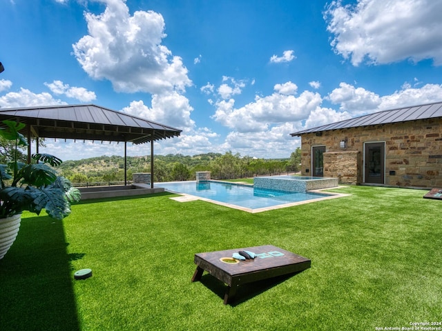 view of swimming pool with a lawn