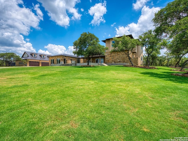 view of yard featuring a garage