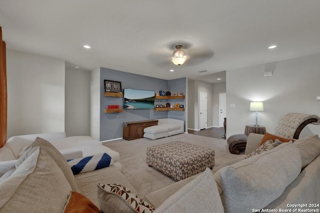 living room with ceiling fan and light carpet