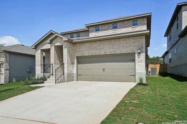 view of front of house with brick siding, a front lawn, concrete driveway, cooling unit, and a garage