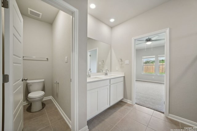 bathroom featuring ceiling fan, tile patterned flooring, vanity, and toilet