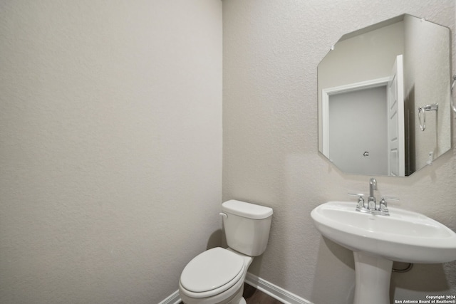 bathroom with sink and toilet