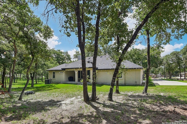 view of property exterior with a yard