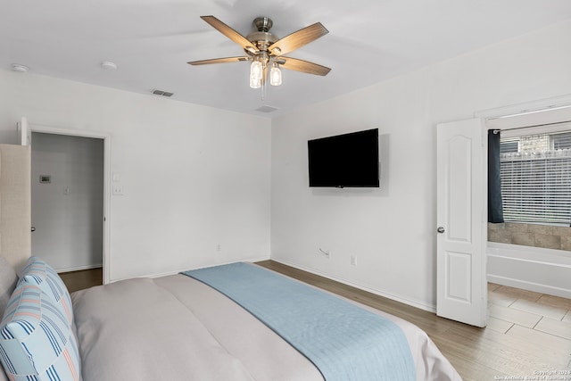 tiled bedroom with ceiling fan