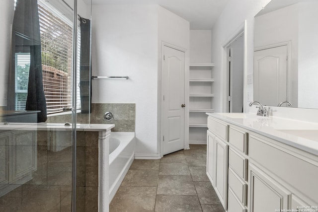 bathroom featuring plus walk in shower and vanity