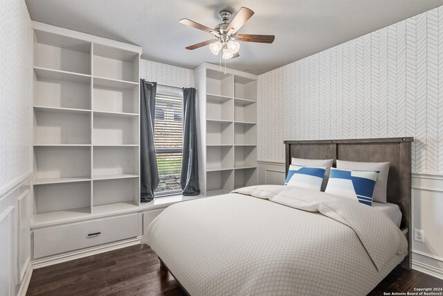 bedroom featuring dark hardwood / wood-style flooring and ceiling fan