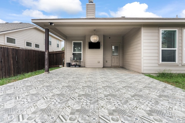 back of property featuring a carport