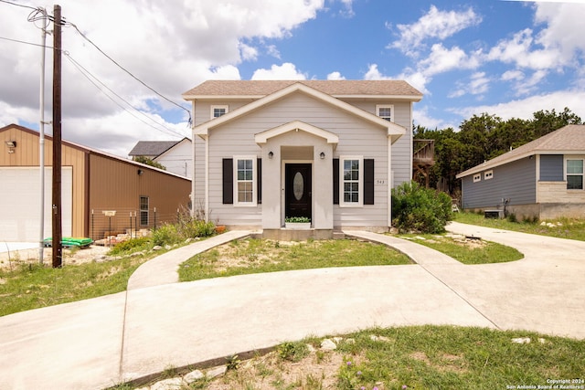 view of front of property with an outbuilding and a garage