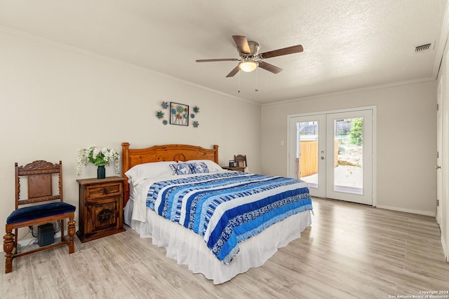 bedroom with access to outside, ceiling fan, light wood-type flooring, a textured ceiling, and ornamental molding