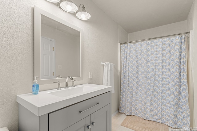 bathroom with vanity and tile patterned floors