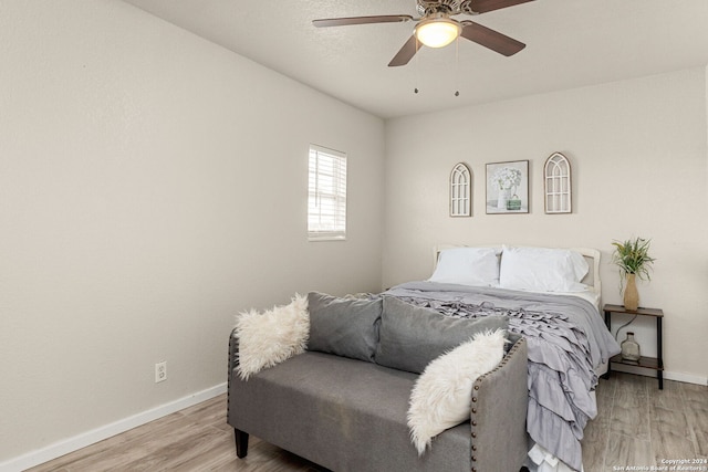 bedroom with ceiling fan and light hardwood / wood-style flooring