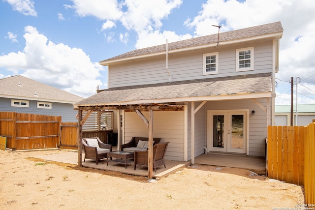 rear view of house featuring french doors, an outdoor hangout area, and a patio