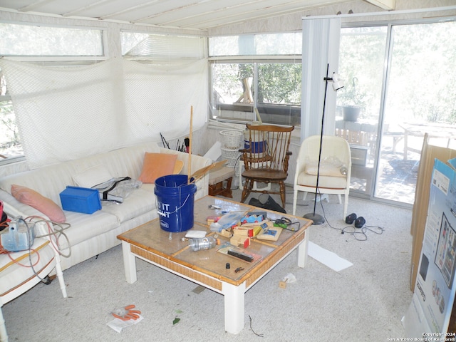 living room featuring vaulted ceiling and carpet