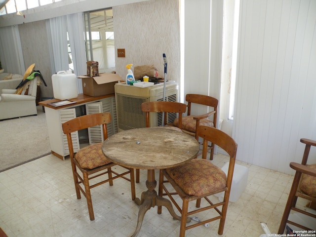 dining space featuring light tile floors