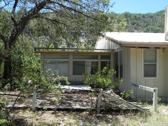 rear view of house with a sunroom