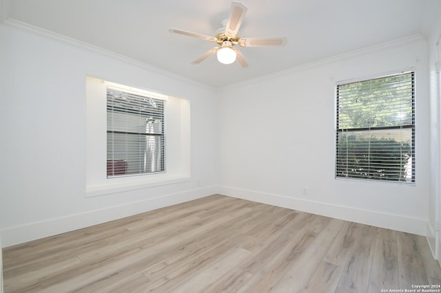 spare room with light hardwood / wood-style floors, ceiling fan, and ornamental molding