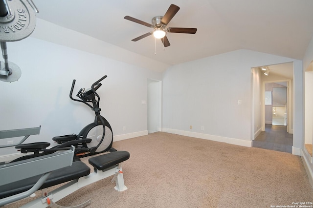 exercise room with ceiling fan, carpet floors, and lofted ceiling