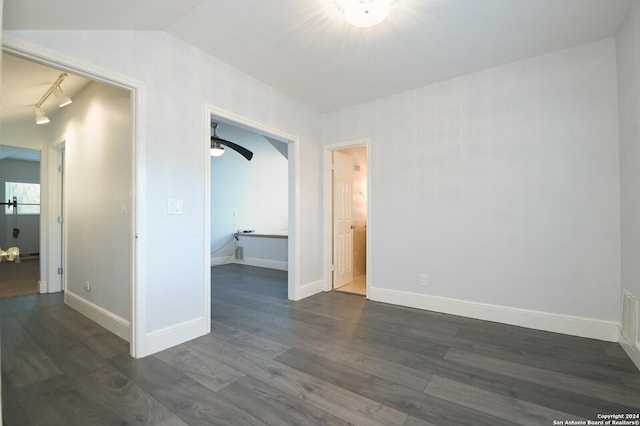 unfurnished room with ceiling fan, dark hardwood / wood-style flooring, and lofted ceiling