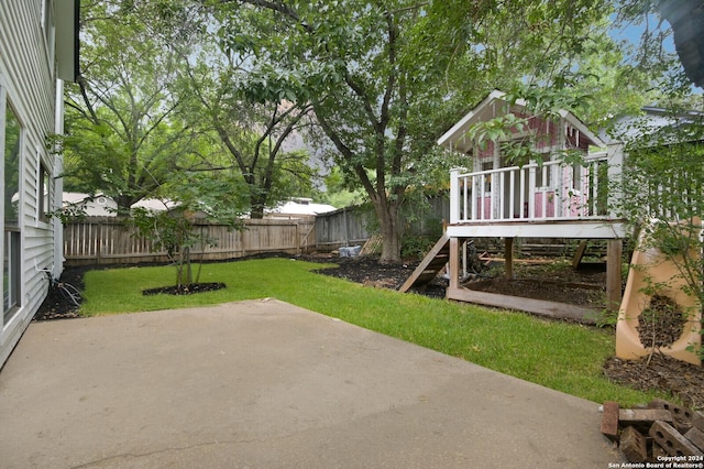 view of yard with a patio area and a playground