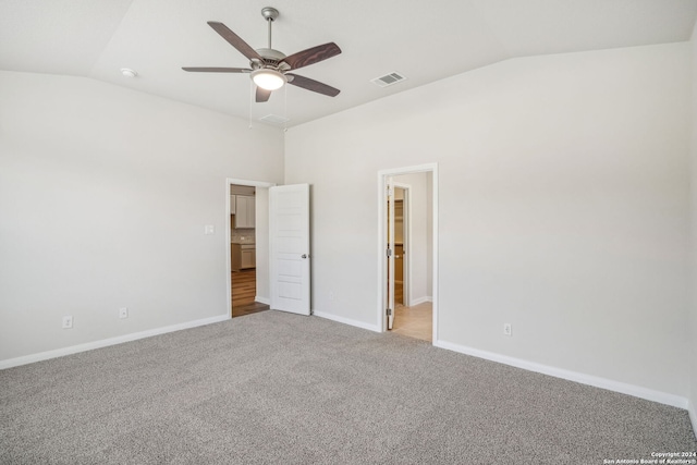 unfurnished bedroom with ceiling fan, light carpet, and lofted ceiling