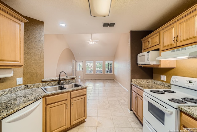 kitchen with sink, vaulted ceiling, light tile patterned floors, ceiling fan, and white appliances