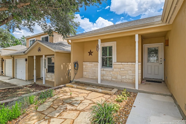 view of exterior entry featuring a garage