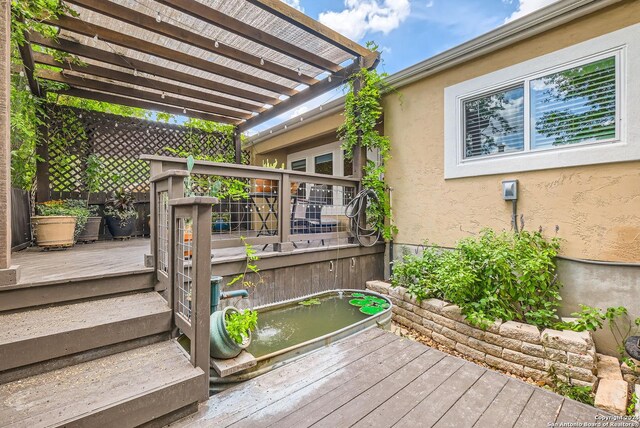 wooden deck with a pergola